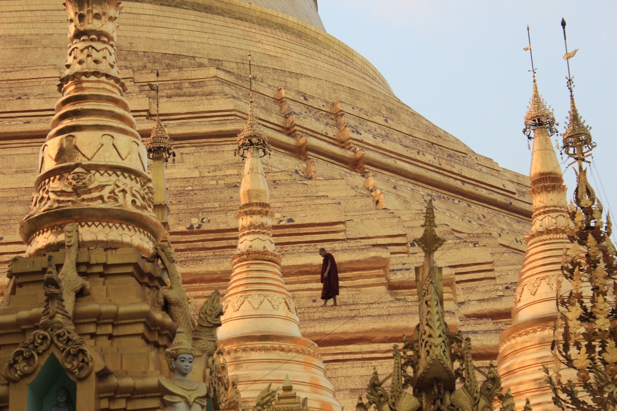 Monk walking on the main stupa at Shwedagon